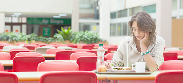 Woman eating alone